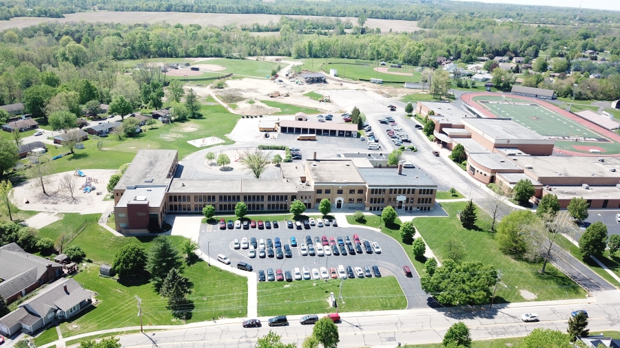 image of a building with cars in the parking lot